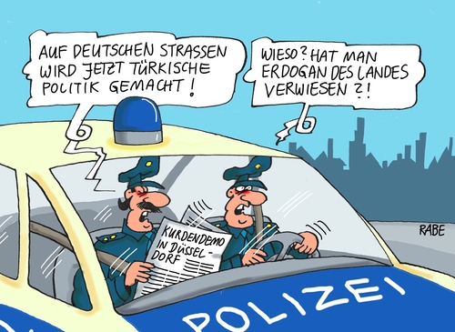 Cartoon: Kurdendemo (medium) by RABE tagged kurden,kurdendemo,islamisten,is,düsseldorf,deutschland,straßen,polizei,gewalt,türken,türkei,erdogan,rabe,ralf,böhme,cartoon,karikatur,pressezeichnung,farbcartoon,tagescartoon,kobaneirak,grenze,nato,luftangriffe,verfassungsschutz,kurden,kurdendemo,islamisten,is,düsseldorf,deutschland,straßen,polizei,gewalt,türken,türkei,erdogan,rabe,ralf,böhme,cartoon,karikatur,pressezeichnung,farbcartoon,tagescartoon,kobaneirak,grenze,nato,luftangriffe,verfassungsschutz