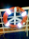 Cartoon: Peace symbol or a life jacket? (small) by Kostis tagged sea,peace,symbol,life,jacket,ship,wind,salt