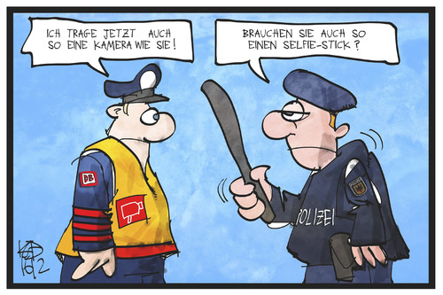 Cartoon: Bodycams (medium) by Kostas Koufogiorgos tagged karikatur,koufogiorgos,illustration,cartoon,bodycam,bahn,sicherheit,polizei,schlagstock,kamera,personal,karikatur,koufogiorgos,illustration,cartoon,bodycam,bahn,sicherheit,polizei,schlagstock,kamera,personal