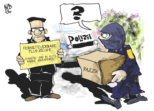 Cartoon: Modellflugzeuge (medium) by Kostas Koufogiorgos tagged modellflugzeug,drohne,eurohawk,maiziere,razzia,polizei,terrorismus,islamismus,karikatur,koufogiorgos,modellflugzeug,drohne,eurohawk,maiziere,razzia,polizei,terrorismus,islamismus,karikatur,koufogiorgos